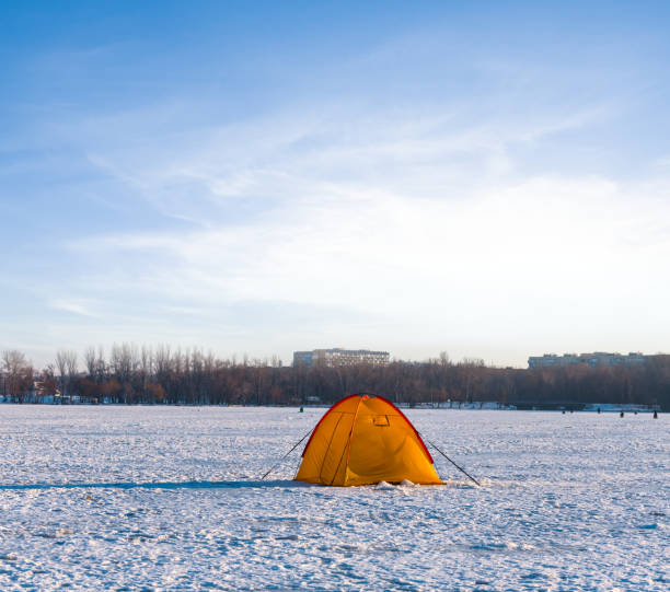 istock orange touristic tent among a vinter snowbound fields 1282494665