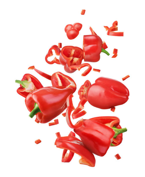 istock Sweet red pepper sliced and falling isolated on a white background 1282495198