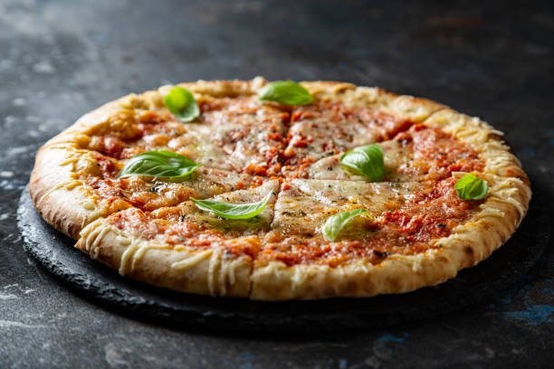 istock Margarita pizza with fresh basil 1282495385