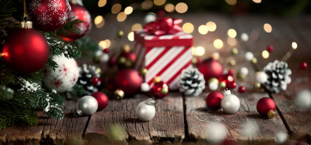 istock Christmas Tree, Red and White Ornaments against a Defocused Lights Background 1282498891
