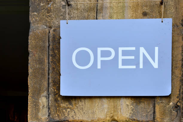 istock close up of blue rectangle metal Open sign 1282498970