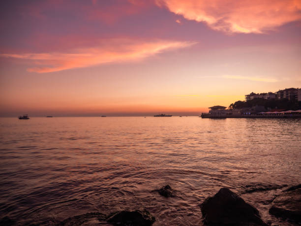istock Sunset on a coastline and calm sea 1282501278