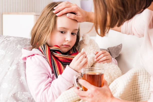 istock Mother checking daughter's fever 1282504211