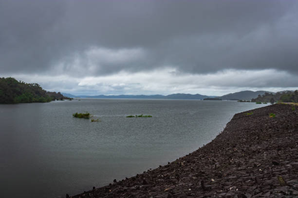 istock river serene backwater with stone edge and dramatic cloudy sky 1282504773