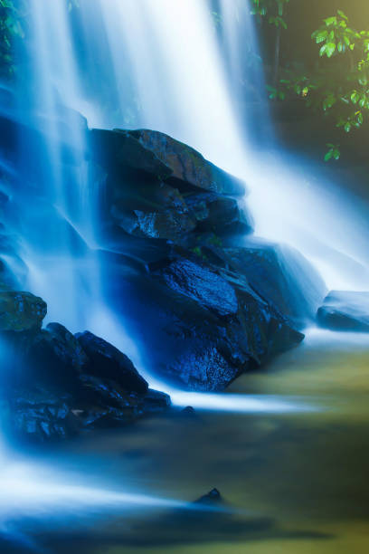 istock Pure tropical waterfall at sunrise. 1282505002
