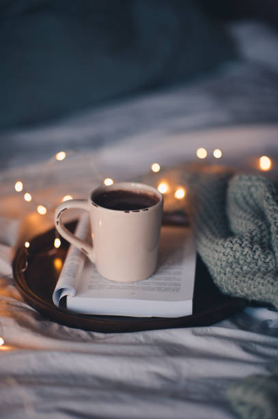 istock Cup of coffee with Christmas lights 1282506335