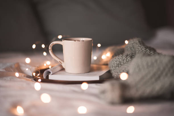 istock Cup of coffee with Christmas lights 1282506345