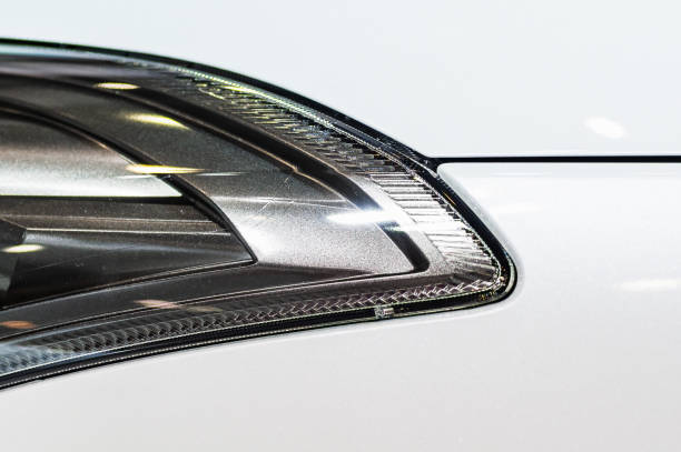 istock Abstract close up image of a head lamp on a white car 1282506482
