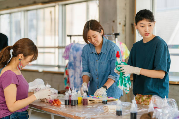 istock Group of people making tie dye together 1282507425