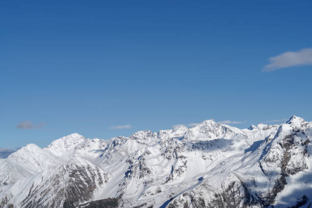istock Scenic view of snowcapped mountains against sky 1282507456