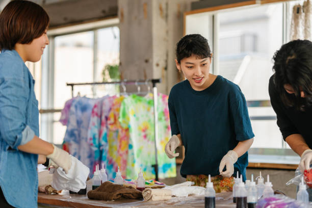 istock Group of people making tie dye together 1282507674