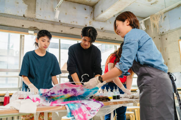 istock Group of people making tie dye together 1282508361