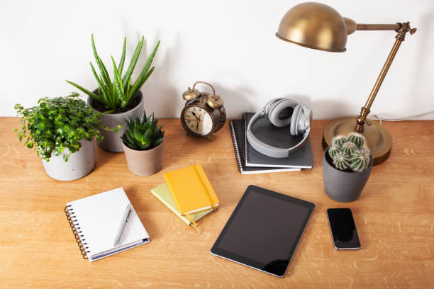 istock home office desk with tablet computer smartphone notebook houseplants, working space at home 1282509164