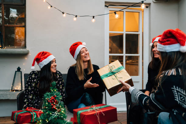 istock Friends exchanging presents for Christmas together 1282509965