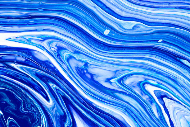 istock Fluid art texture. Backdrop with abstract mixing paint effect. Liquid acrylic artwork that flows and splashes. Mixed paints for background or poster. Blue, navy blue and white overflowing colors. 1282512922