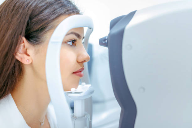 istock Young woman checking eyesight at ophthalmologist's 1282514732