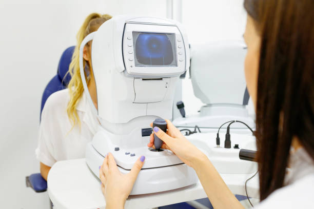 istock Female ophthalmologist doing eye exam using electronic equipment 1282514800