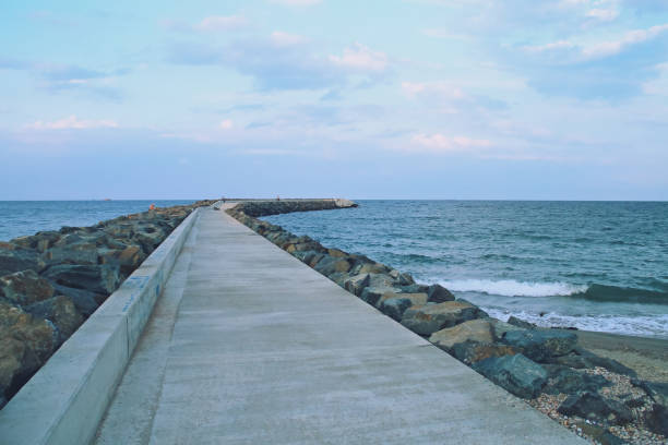 istock Breakwater at Three Slippers Beach (English; Three slippers beach) in Constanta, Romania. 1282519837