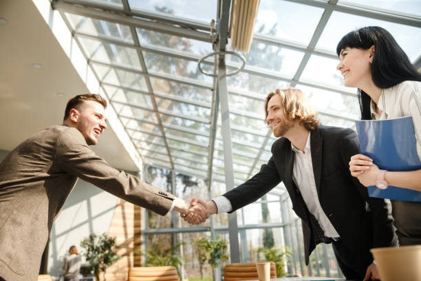 istock Two businessmen are shaking hands 1282520072