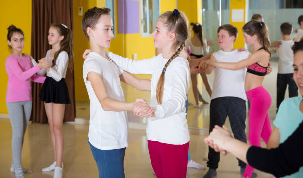 istock Children dancing slow ballroom dances in pairs 1282520369