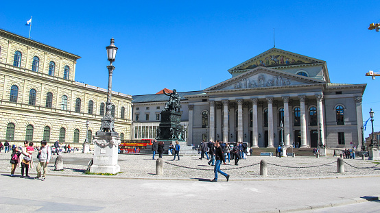 In April 2015, people were walking on the town square of the National Theater in Munich.