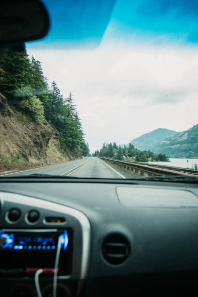 istock Passenger Perspective Front Seat of Moving Car on Road Trip 1282523257