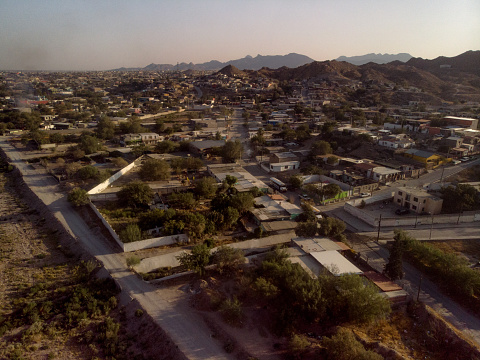 Drone video of the iconic, controvercial border wall between the United States and Mexico, from the  poverty stricken side Puerto Anapra, Chihuahua, Mexico