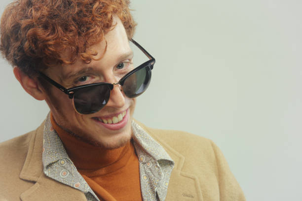 istock hipster looking over glasses close up 1282526018