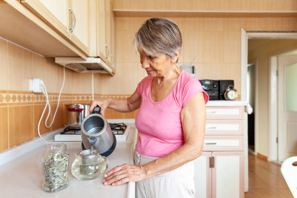 istock Senior women making herbal tea 1282526096