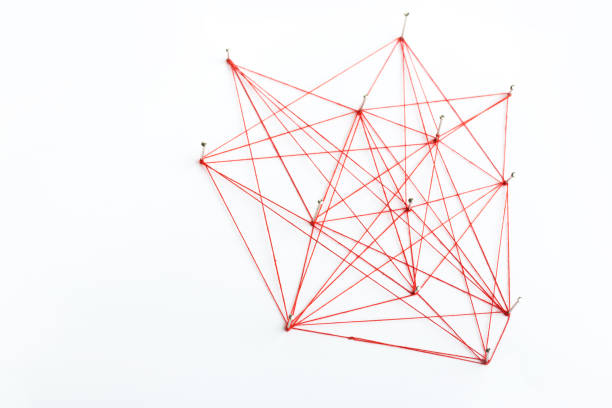 istock A large mesh of pins connected with a cord. Communication, network concept. Red 1282526588