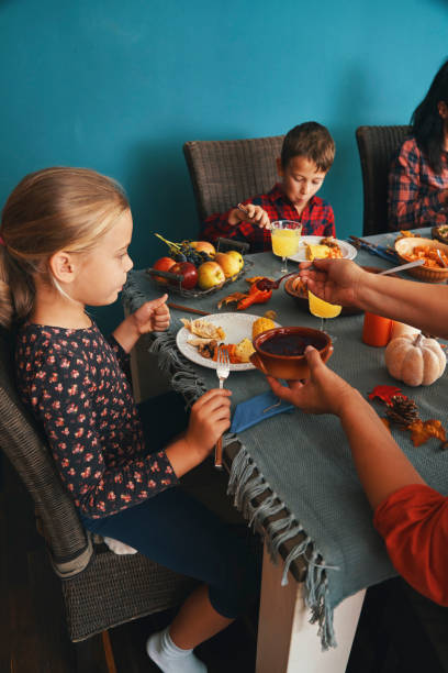 istock Family Having Traditional Holiday Stuffed Turkey Dinner 1282526590