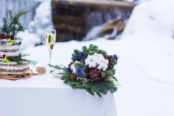 istock Winter style wedding cake. Rustic style.  wedding in winter. Wedding decor, cake, glasses, champagne, plates. 1282527688
