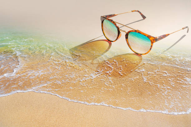 istock Vintage sunglasses put on the beach. 1282530449