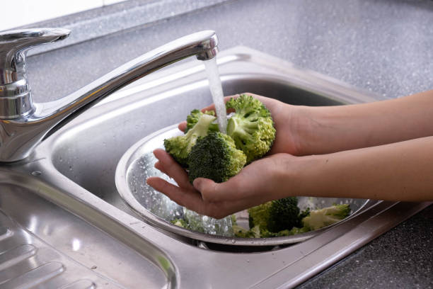 istock in the hands of broccoli washed under running water 1282531797