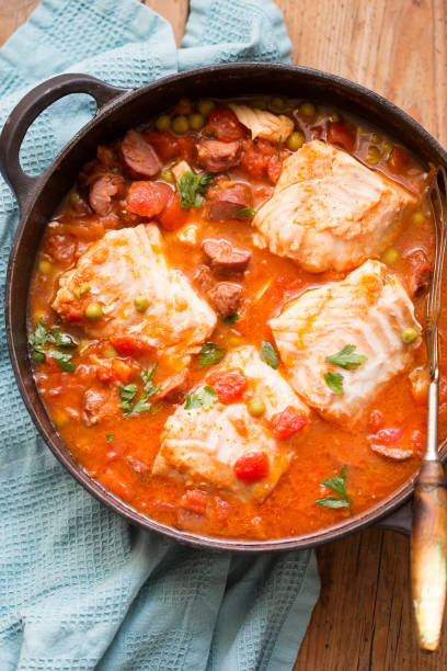istock Cod chorizo stew with peas and parsley in tomato sauce 1282531898