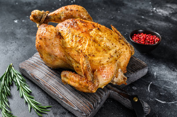 istock Grilled roasted whole Chicken.  Black background. Top view 1282532148