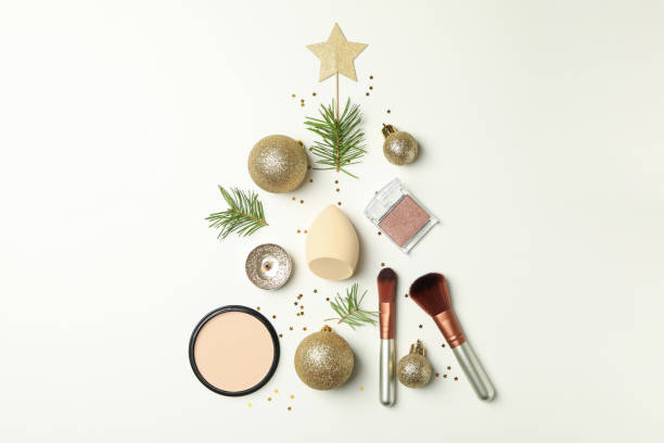 istock Christmas tree made of cosmetics and baubles on white background 1282537133
