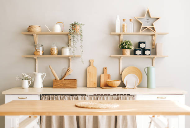 istock Kitchen with wooden dishes and kitchen accessories on the table and shelves. 1282538283
