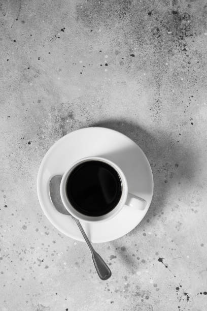 istock A white Cup of coffee on a gray table 1282538846