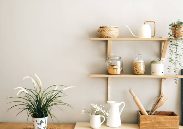 istock Grocery and kitchenware on the wooden shelves in modern bright kitchen. 1282538936