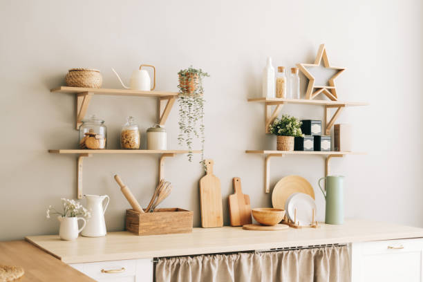 istock Kitchen with wooden dishes and kitchen accessories on the table and shelves. 1282539714