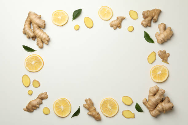 istock Fresh ginger and lemon on white background, top view 1282540364