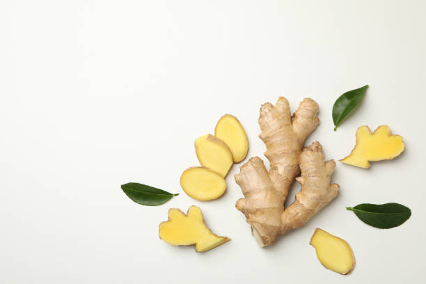 istock Fresh raw ginger and leaves on white background 1282540982