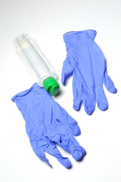 istock medical gloves and jar with sanitizer. 1282541042