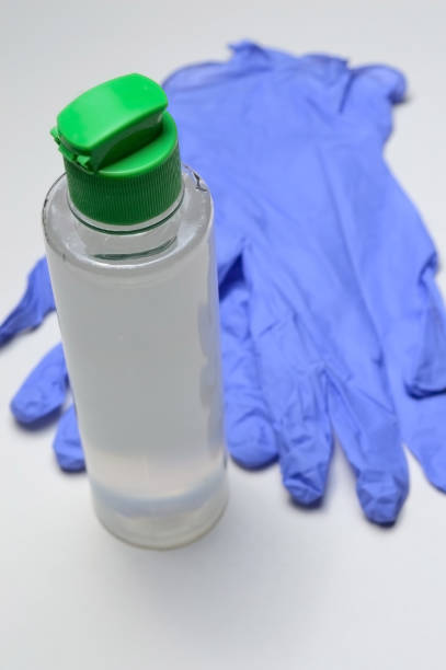 istock medical gloves and jar with sanitizer. 1282541078