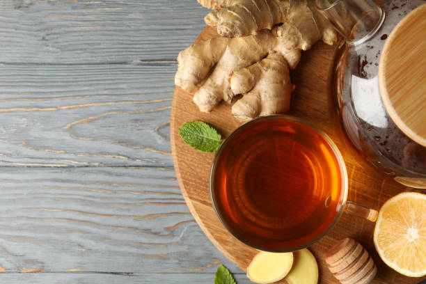 istock Concept of breakfast with ginger tea on wooden background 1282541086