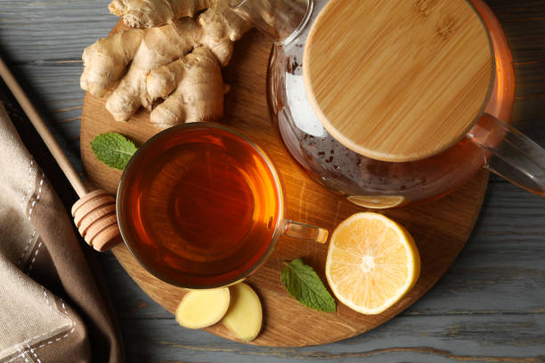 istock Concept of breakfast with ginger tea on wooden background 1282541187