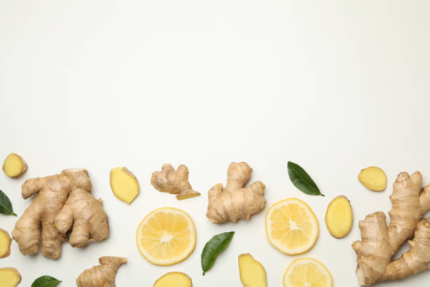 istock Fresh ginger and lemon on white background, top view 1282541216