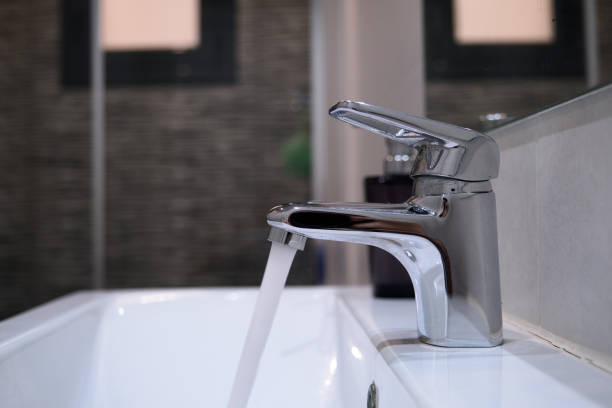 istock broken faucet in a bathroom leaking water 1282541394