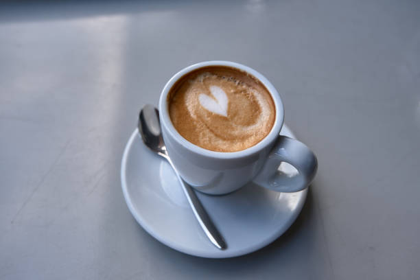 istock Cup of coffee on a wooden table 1282541416